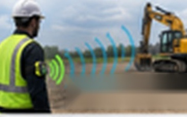 Worker carrying SafeCard near equipment